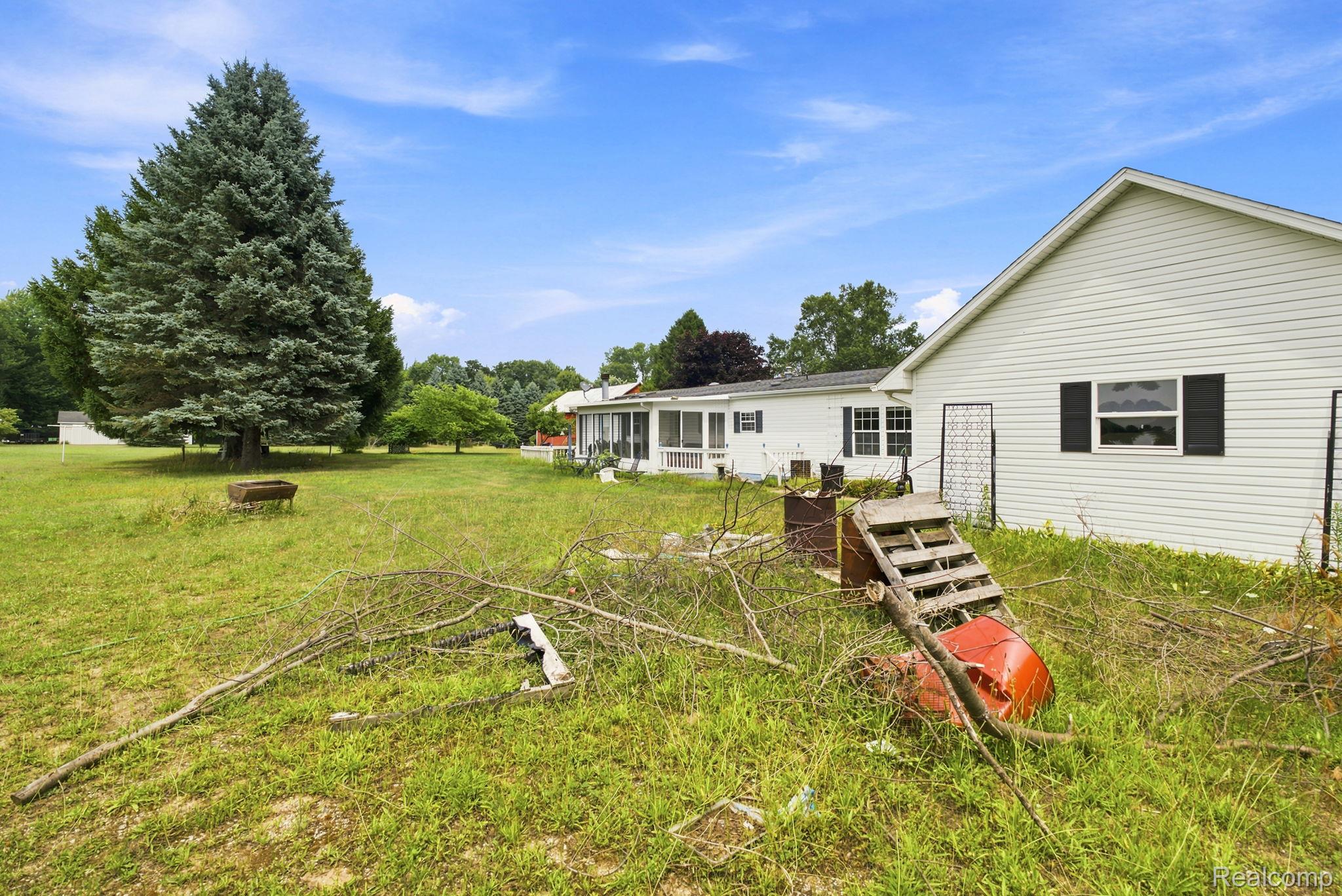 2390 Lakeshore Road Applegate, MI 48401 - Photo 33 of 97 Spacious manufactured home situated on expansive grounds with mature evergreen and deciduous trees