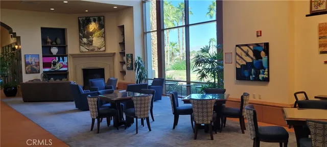 a view of a lake with a table and chairs