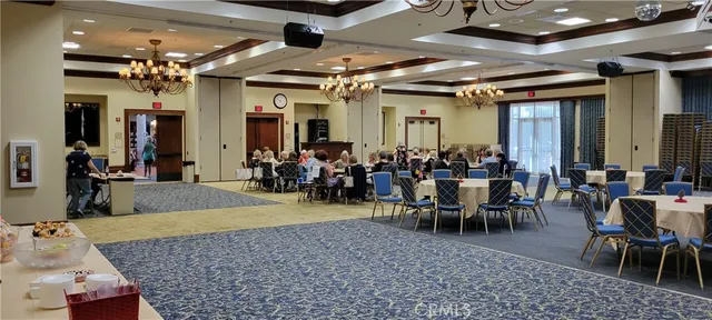 a view of a swimming pool with a garden and trees