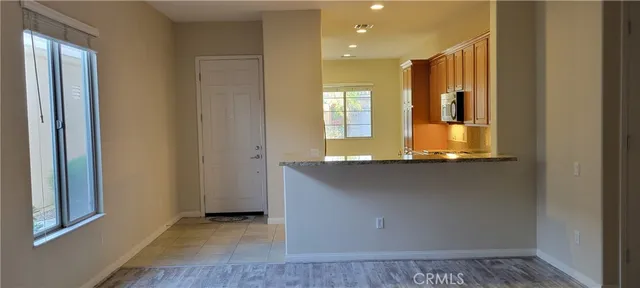 a room with pool table and a chandelier