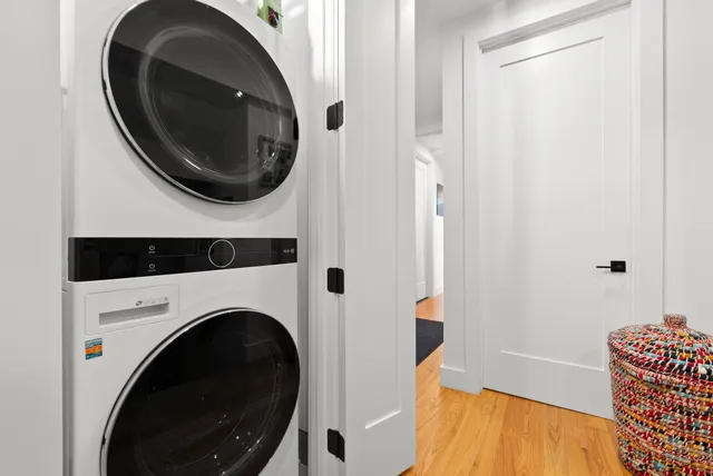 a view of a bedroom with washer and dryer