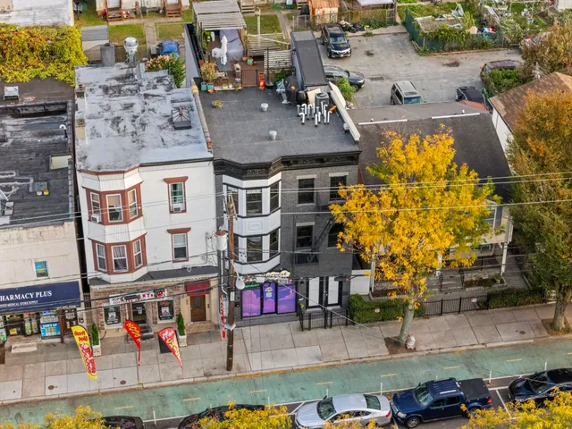 an aerial view of multiple houses with outdoor space