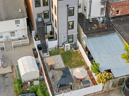 a view of an chairs and tables in the balcony