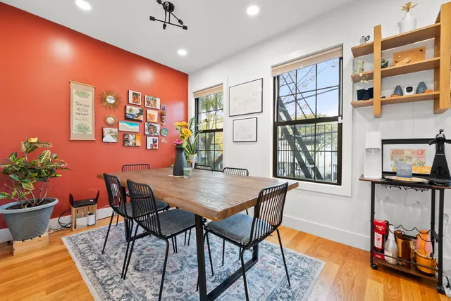 a view of a livingroom with furniture window and wooden floor