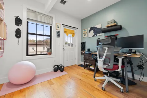 a view of a bedroom with washer and dryer