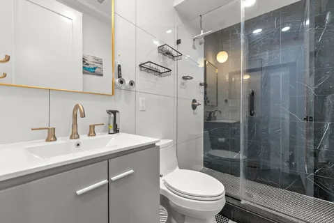 a view of a patio with chairs and plants