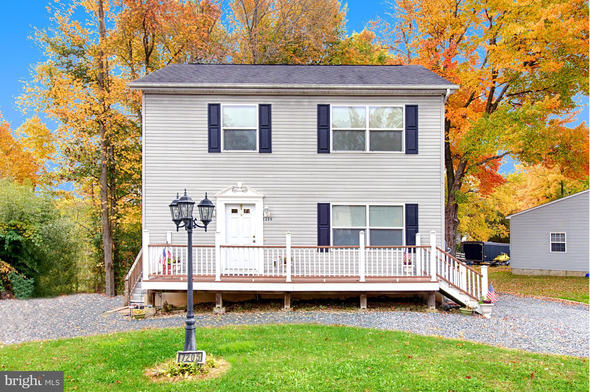 7205 Gunpowder Road Middle River, MD 21220 - Photo 1 of 25 a backyard of a house with table and chairs