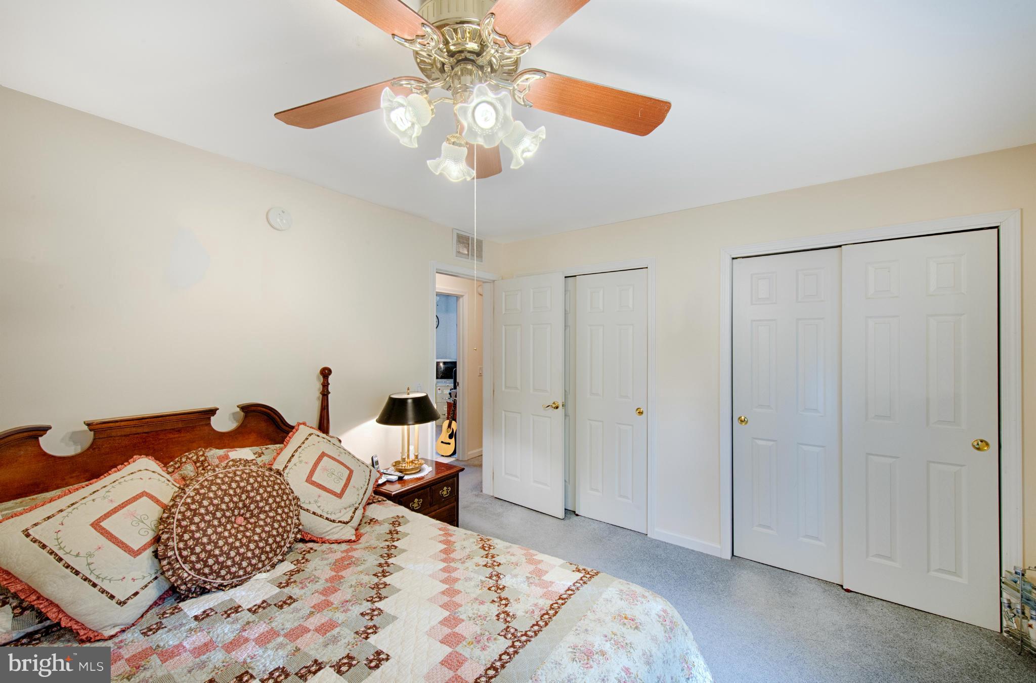 7205 Gunpowder Road Middle River, MD 21220 - Photo 13 of 25 a bedroom with a bed and a chandelier
