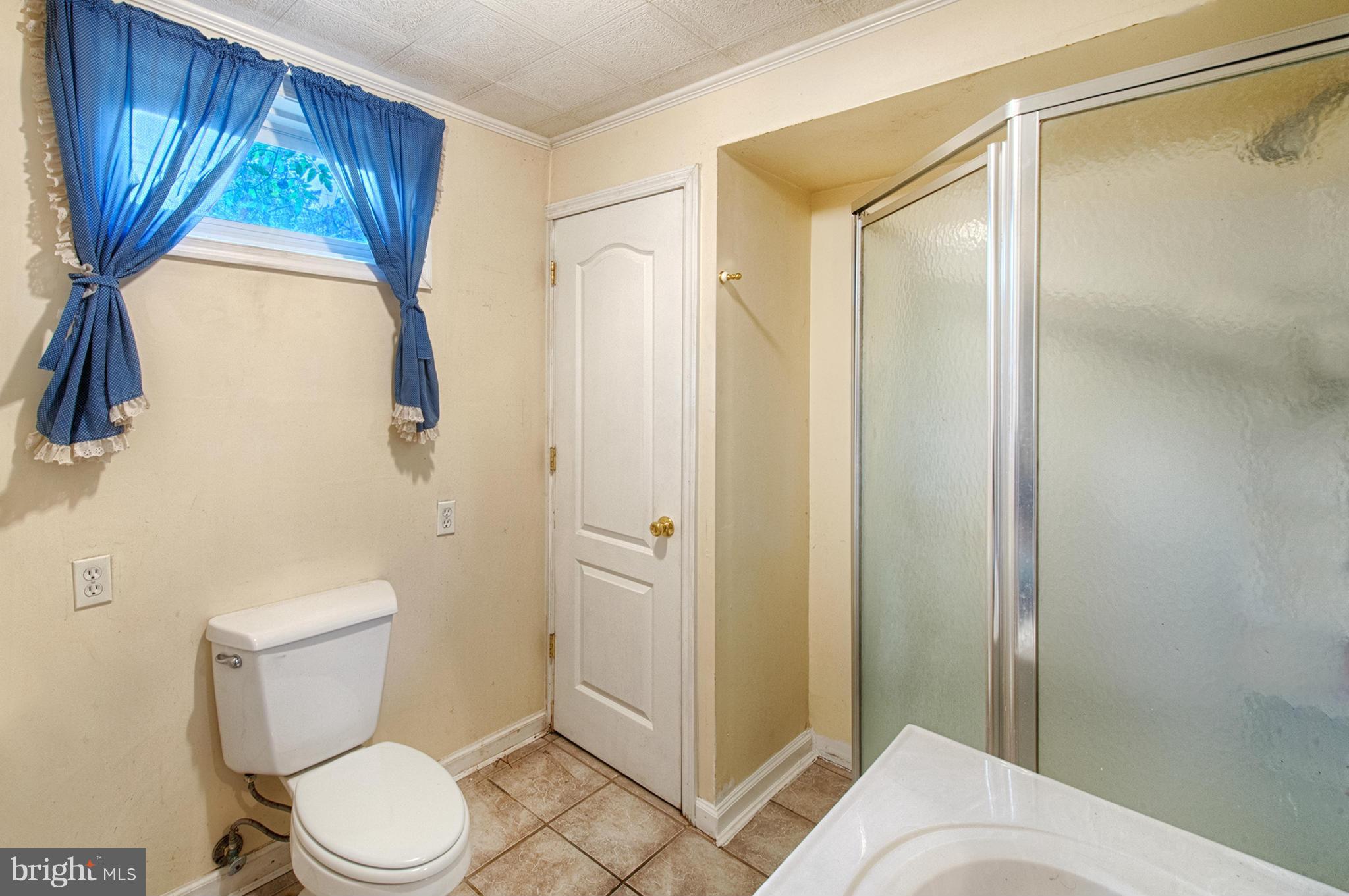 7205 Gunpowder Road Middle River, MD 21220 - Photo 22 of 25 a bathroom with a toilet and a shower