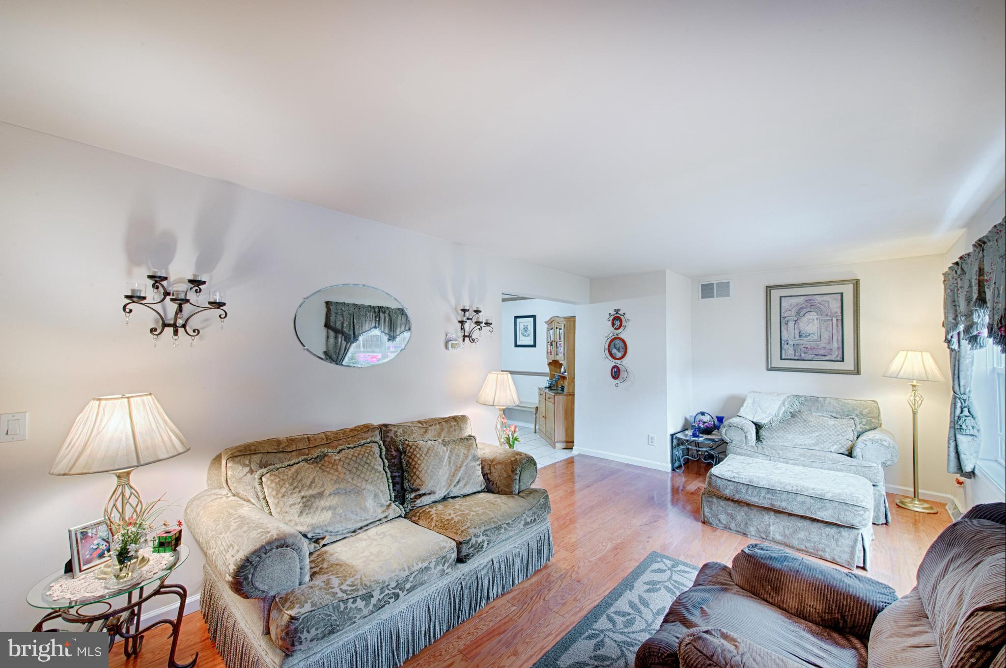 7205 Gunpowder Road Middle River, MD 21220 - Photo 6 of 25 a living room with furniture and a lamp