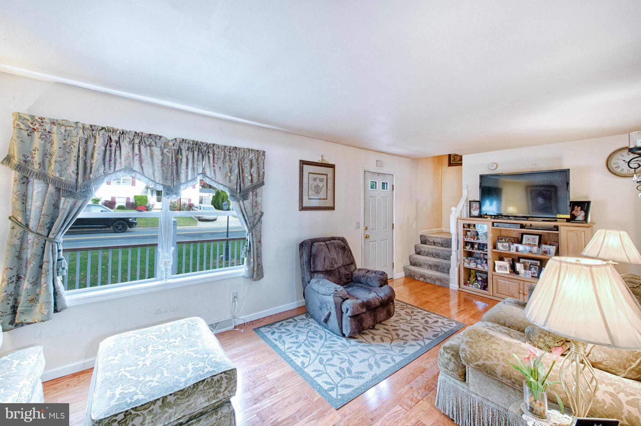 7205 Gunpowder Road Middle River, MD 21220 - Photo 7 of 25 a living room with furniture and a window