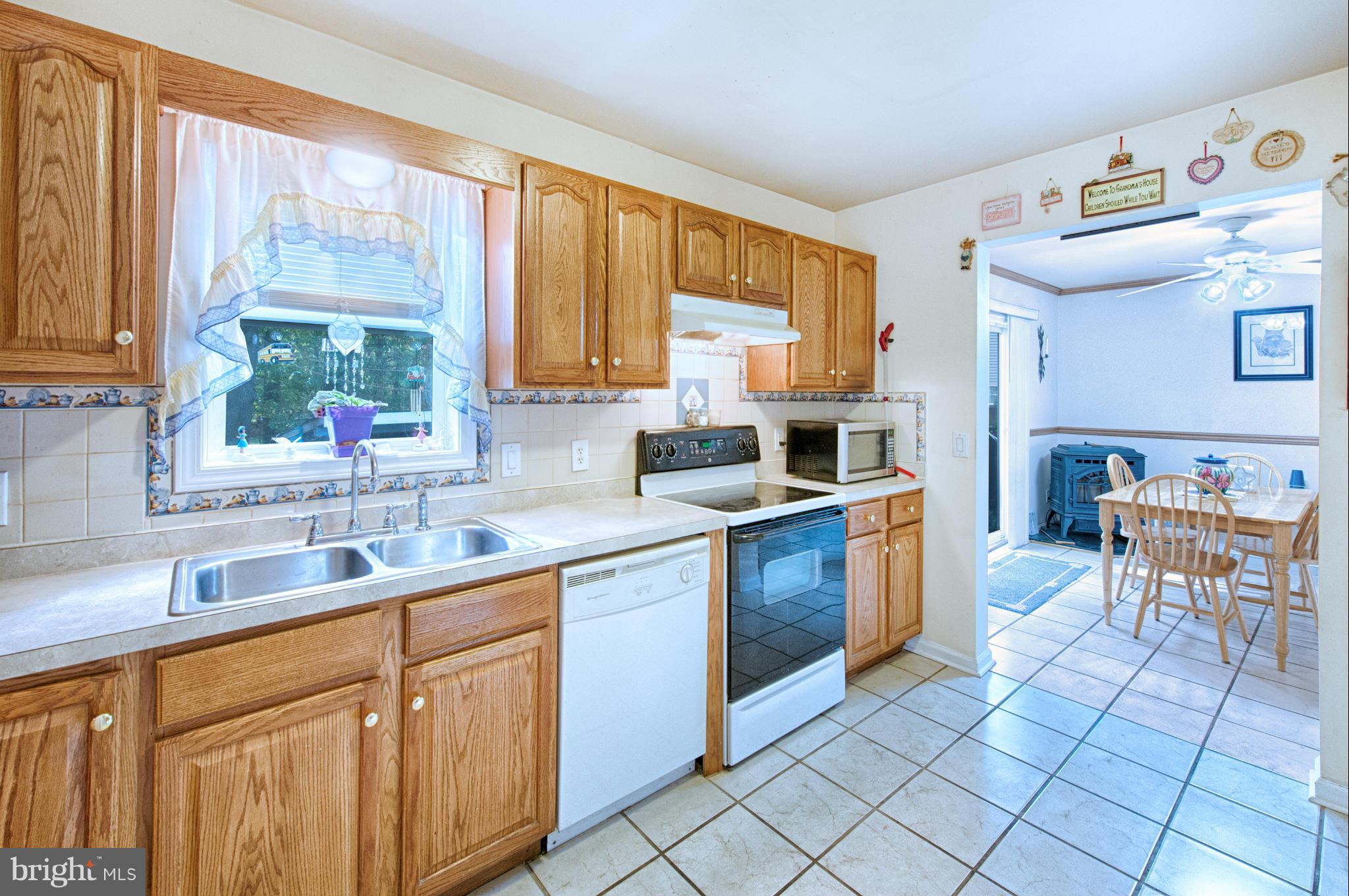 7205 Gunpowder Road Middle River, MD 21220 - Photo 9 of 25 a kitchen with a sink stove and cabinets