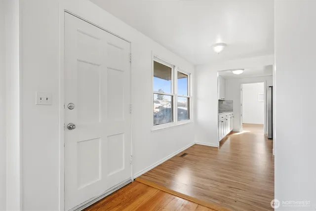 a view of livingroom with hardwood floor and hallway