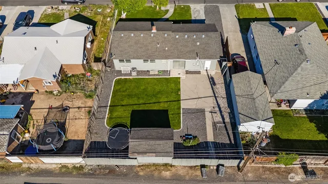 an aerial view of a house with a swimming pool