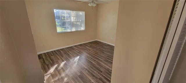 a bathroom with a tub and a glass door