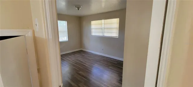 a bathroom with a granite countertop toilet and a shower