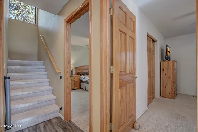 a view of entryway with wooden floor and stairs
