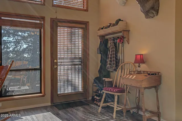 a view of a room with furniture and wooden floor