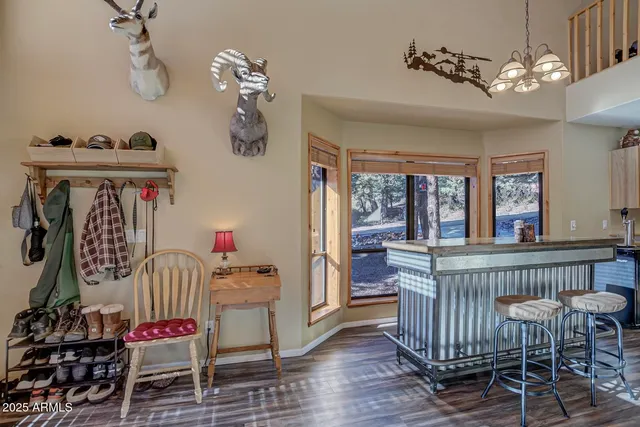 a bedroom with furniture and wooden floor