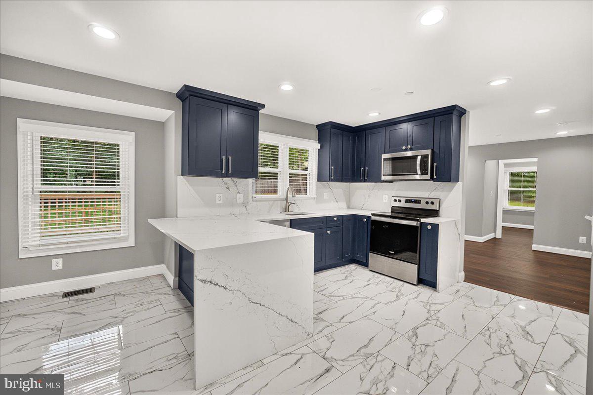 2683 Walston Road Mount Airy, MD 21771 - Photo 16 of 62 Modern kitchen with sleek finishes.