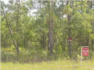 4.5 Elmwood Road DeFuniak Springs, FL 32433 - Photo 1 of 1 a bathroom with a small yard