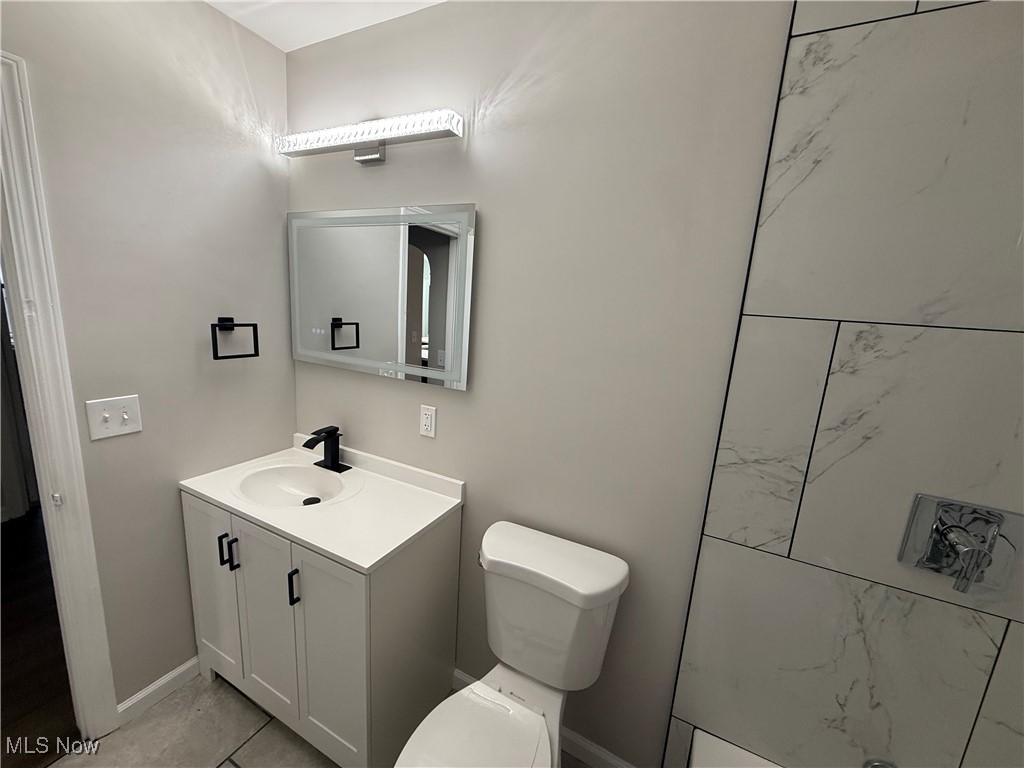 4658 Burleigh Road Cleveland, OH 44125 - Photo 12 of 24 Bathroom with vanity and toilet