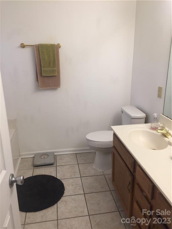 6019 Double Rein Road Charlotte, NC 28215 - Photo 15 of 21 a bathroom with a sink toilet and mirror