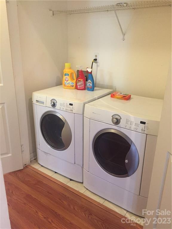 6019 Double Rein Road Charlotte, NC 28215 - Photo 20 of 21 a utility room with dryer and washer