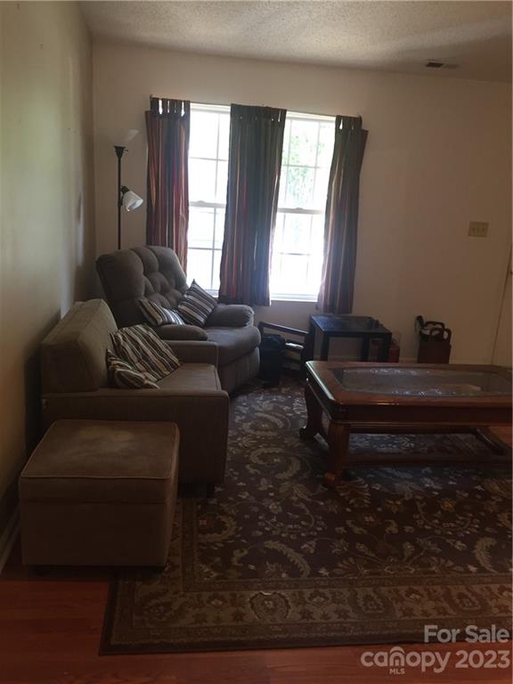 6019 Double Rein Road Charlotte, NC 28215 - Photo 5 of 21 a living room with furniture and a window