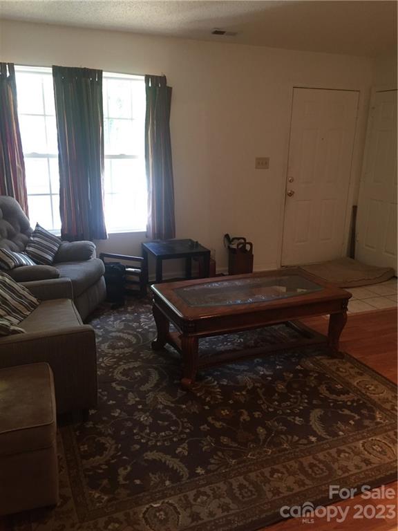 6019 Double Rein Road Charlotte, NC 28215 - Photo 6 of 21 a living room with furniture and a window