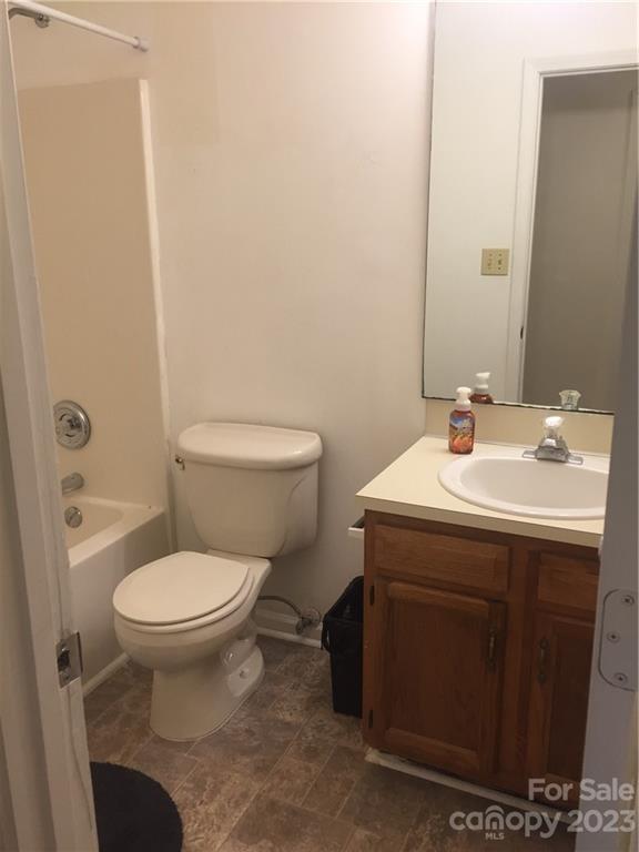 6019 Double Rein Road Charlotte, NC 28215 - Photo 10 of 21 a bathroom with a sink toilet and a mirror