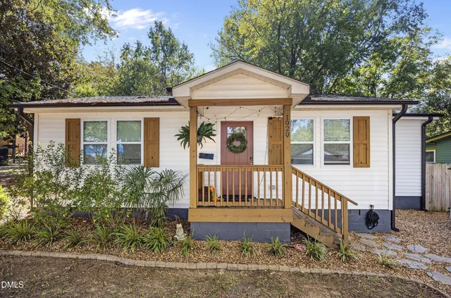 a front view of a house with a porch