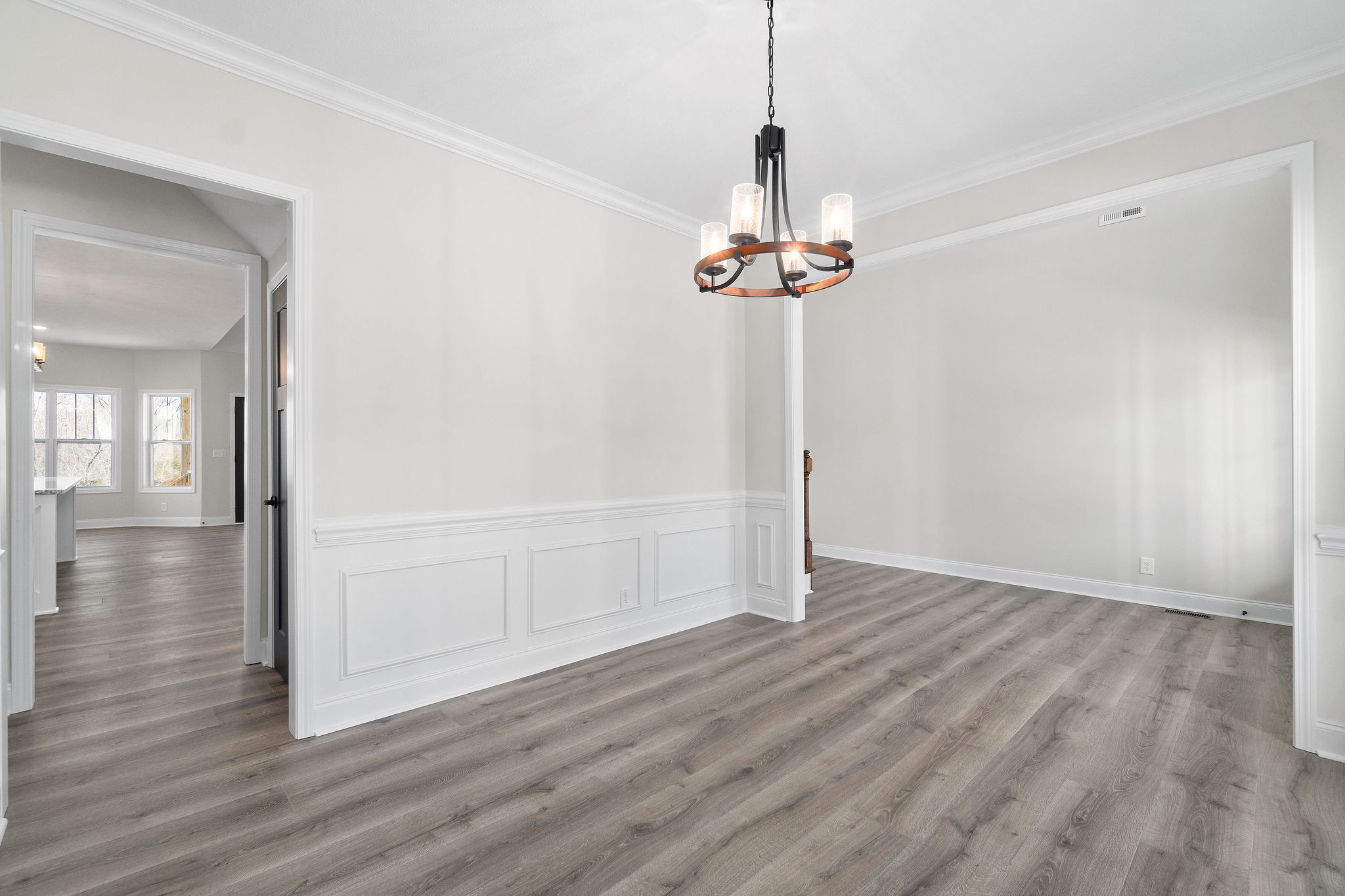 1387 Southside Road Southside, TN 37171 - Photo 14 of 34 a view of an empty room with wooden floor and a chandelier