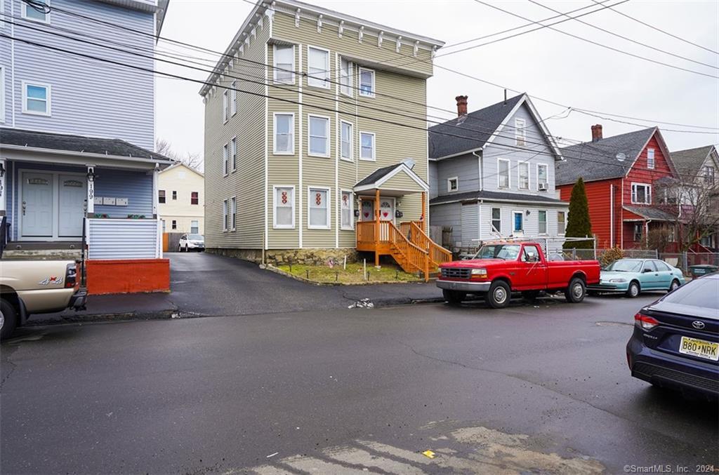 205 Smith Street Bridgeport, CT 06607 - Photo 1 of 1 a car parked in front of a house