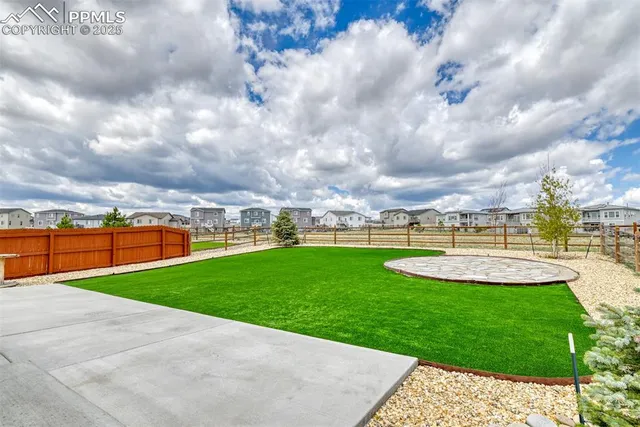 a view of a garden with houses