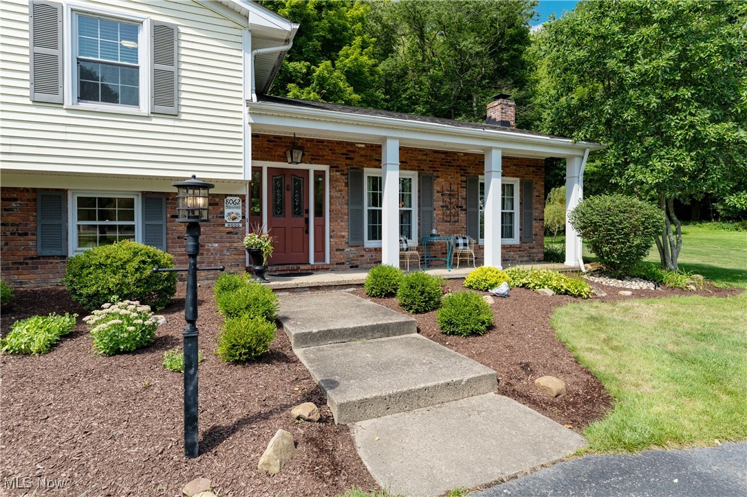 8062 Chagrin Road Chagrin Falls, OH 44023 - Photo 5 of 50 The tastefully landscaped entry and welcoming front porch create an inviting first impression and set the tone for the warmth and charm found throughout the home.