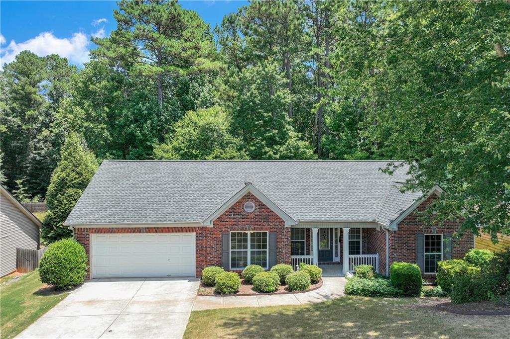 330 Red Bud Road Jefferson, GA 30549 - Photo 1 of 1 a house with a tree in front of it