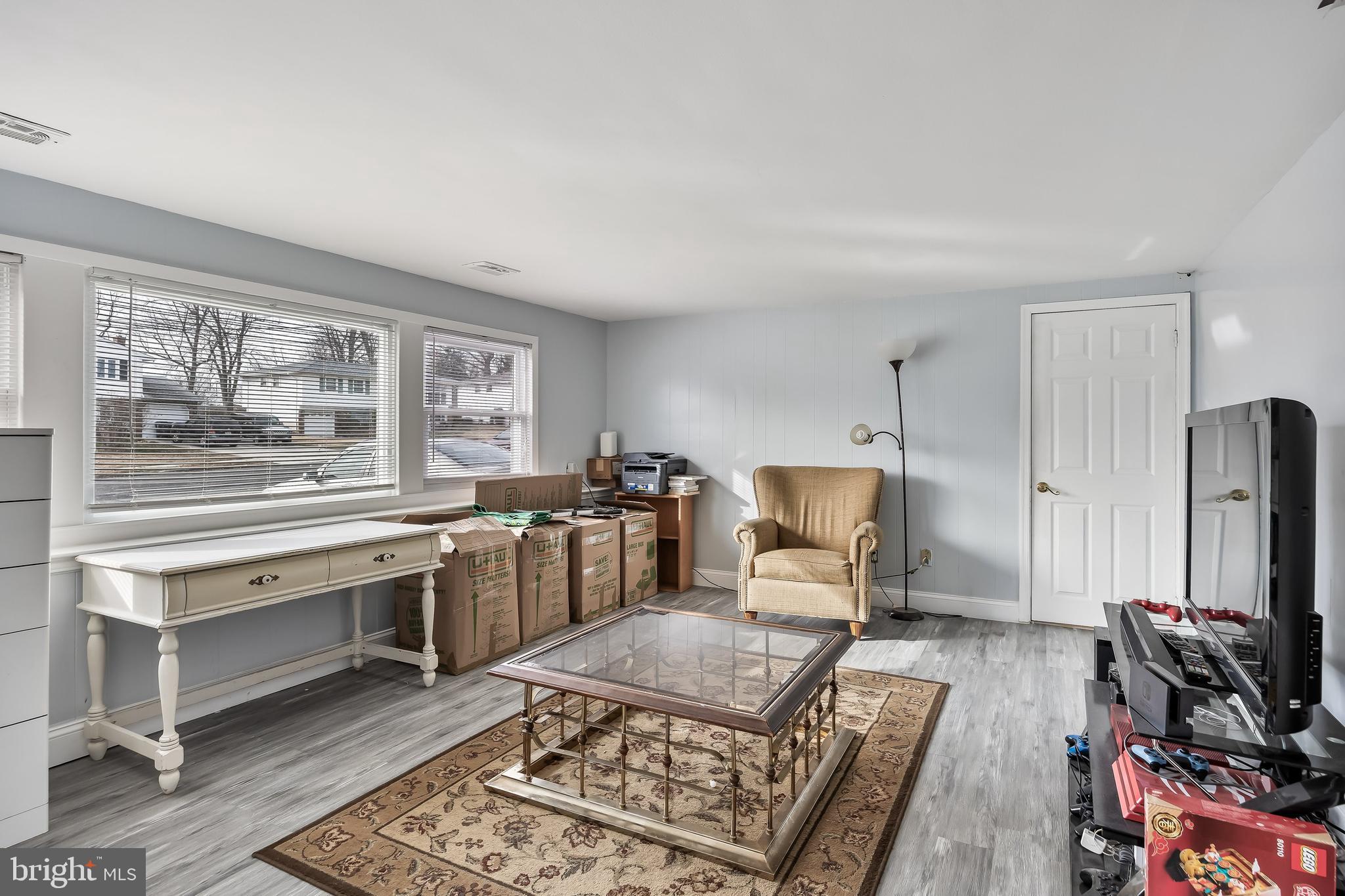 51 Suburban Boulevard Delran, NJ 08075 - Photo 16 of 29 a living room with furniture a flat screen tv and a table