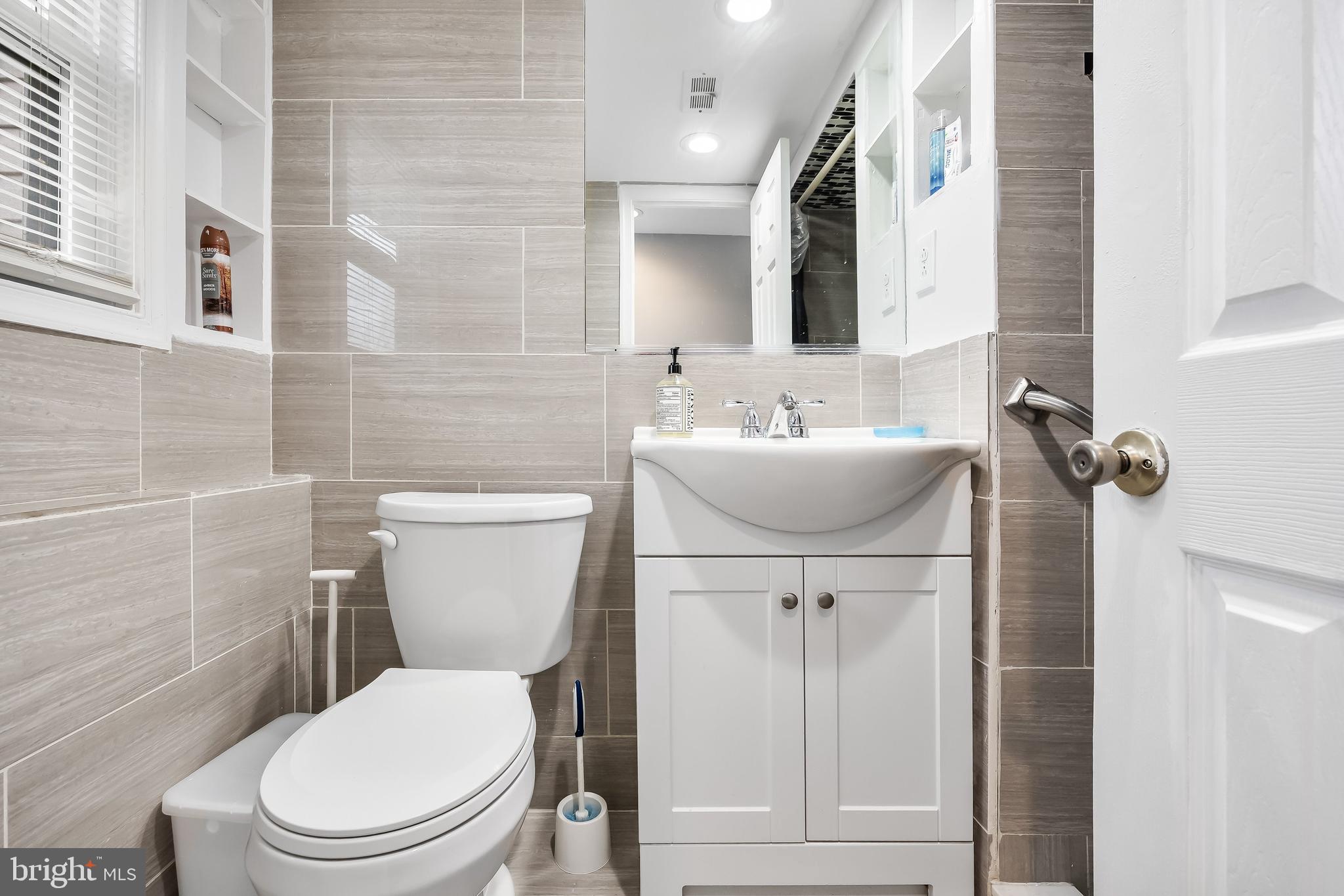 51 Suburban Boulevard Delran, NJ 08075 - Photo 19 of 29 a bathroom with a toilet sink and mirror