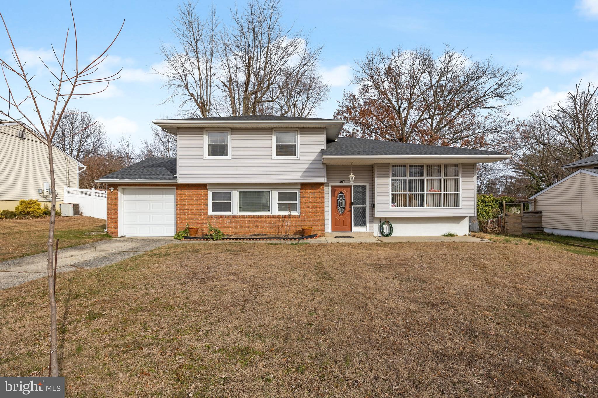 51 Suburban Boulevard Delran, NJ 08075 - Photo 2 of 29 front view of a house with a trees