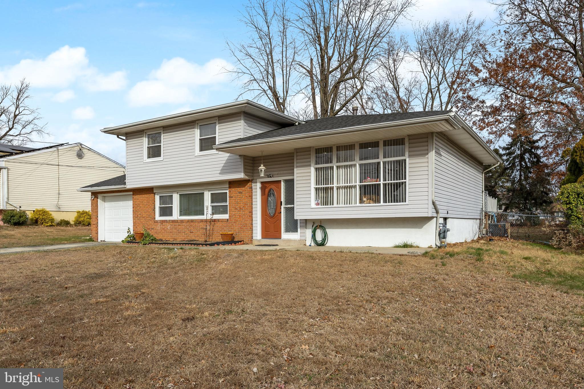 51 Suburban Boulevard Delran, NJ 08075 - Photo 3 of 29 a house that has a tree in front of a white house
