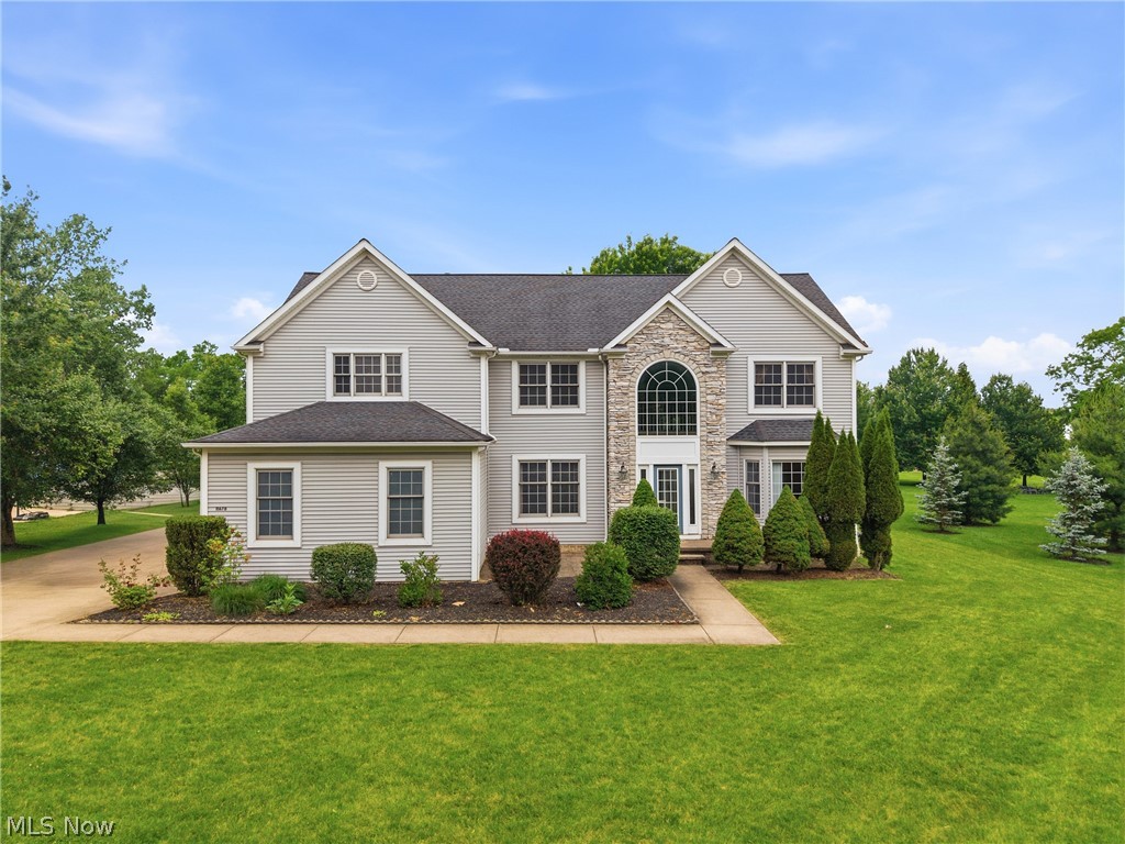 11678 Dunham Road Northfield, OH 44067 - Photo 1 of 38 Stately two-story residence featuring light gray siding with a stone facade accent