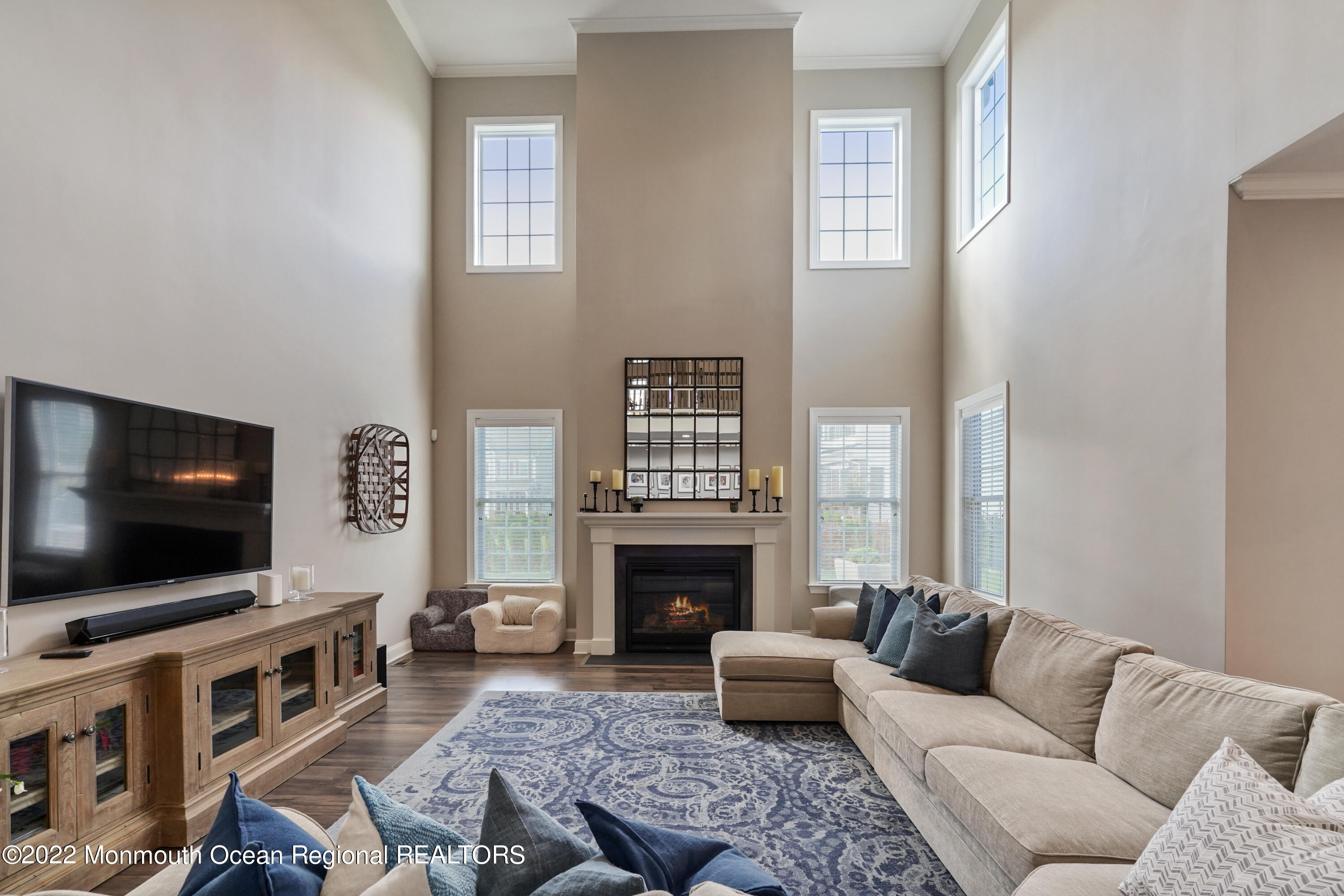 6 Runyon Road Middletown, NJ 07748 - Photo 8 of 37 a living room with furniture and a flat screen tv