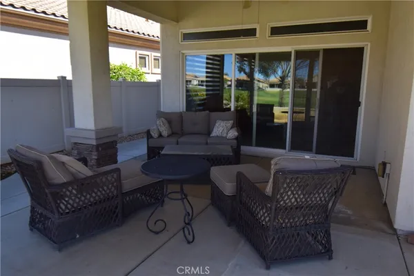 a outdoor living space with furniture and potted plants