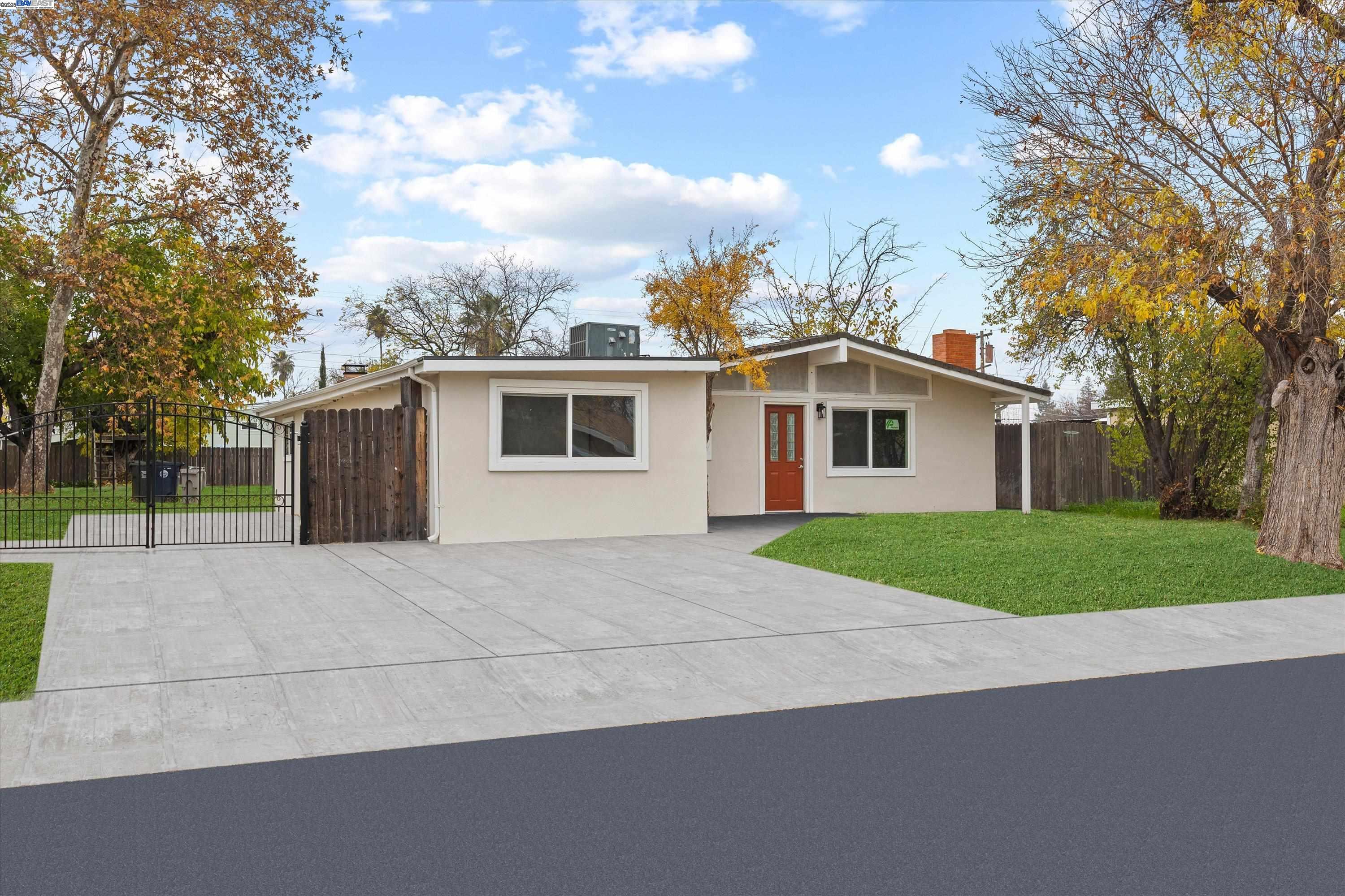 7941 Andora Way Sacramento, CA 95824 - Photo 1 of 1 a view of a house with a yard and large trees
