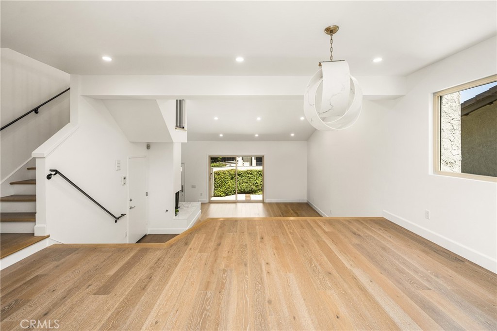 8 Moon Shadow, Unit 8 Irvine, CA 92603 - Photo 12 of 42 a view of empty room with wooden floor