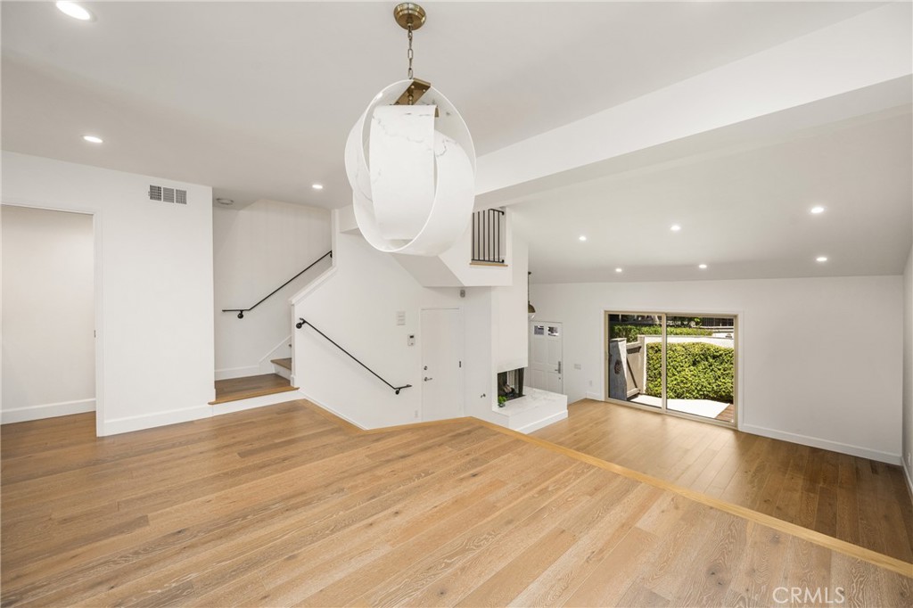 8 Moon Shadow, Unit 8 Irvine, CA 92603 - Photo 13 of 42 a view of empty room with wooden floor and window