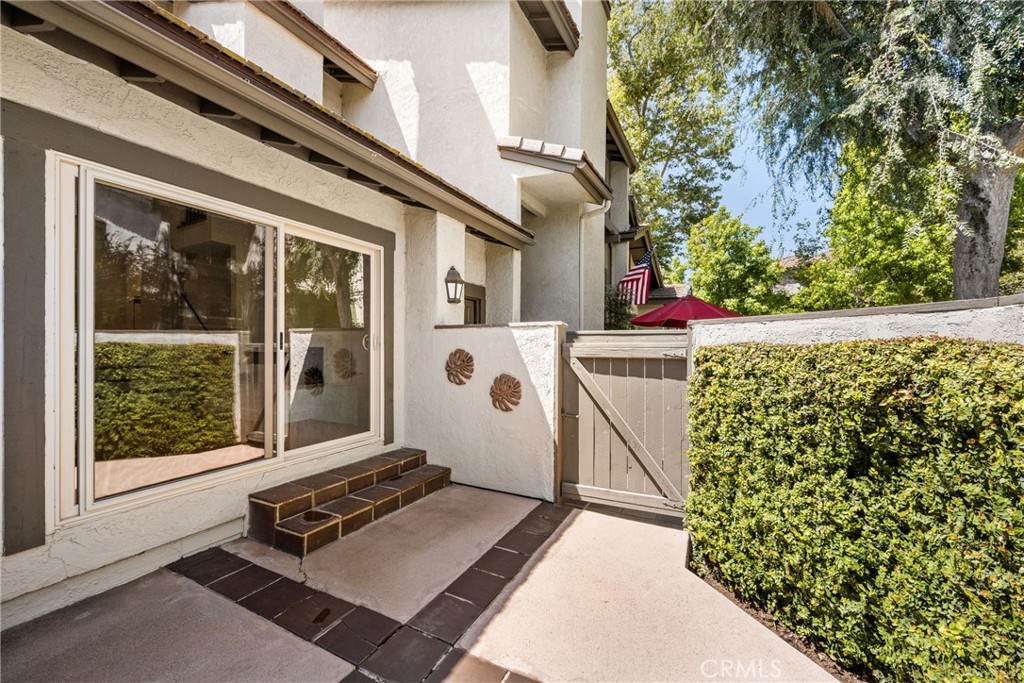 8 Moon Shadow, Unit 8 Irvine, CA 92603 - Photo 14 of 42 a front view of a house with a garden