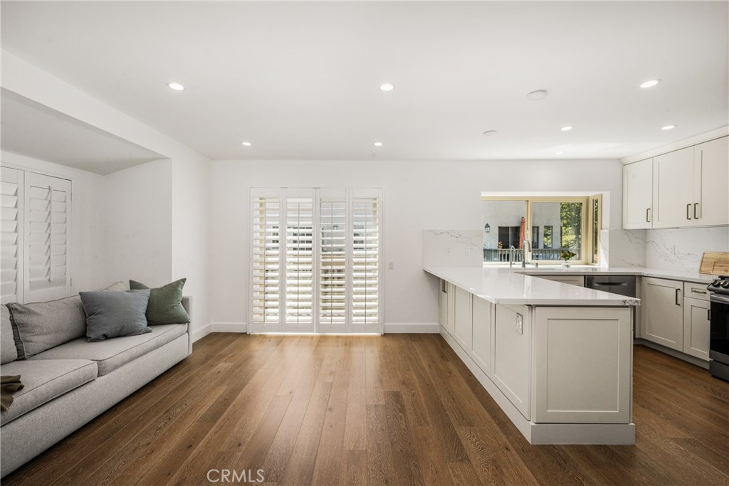 8 Moon Shadow, Unit 8 Irvine, CA 92603 - Photo 15 of 42 a living room with furniture and a large window