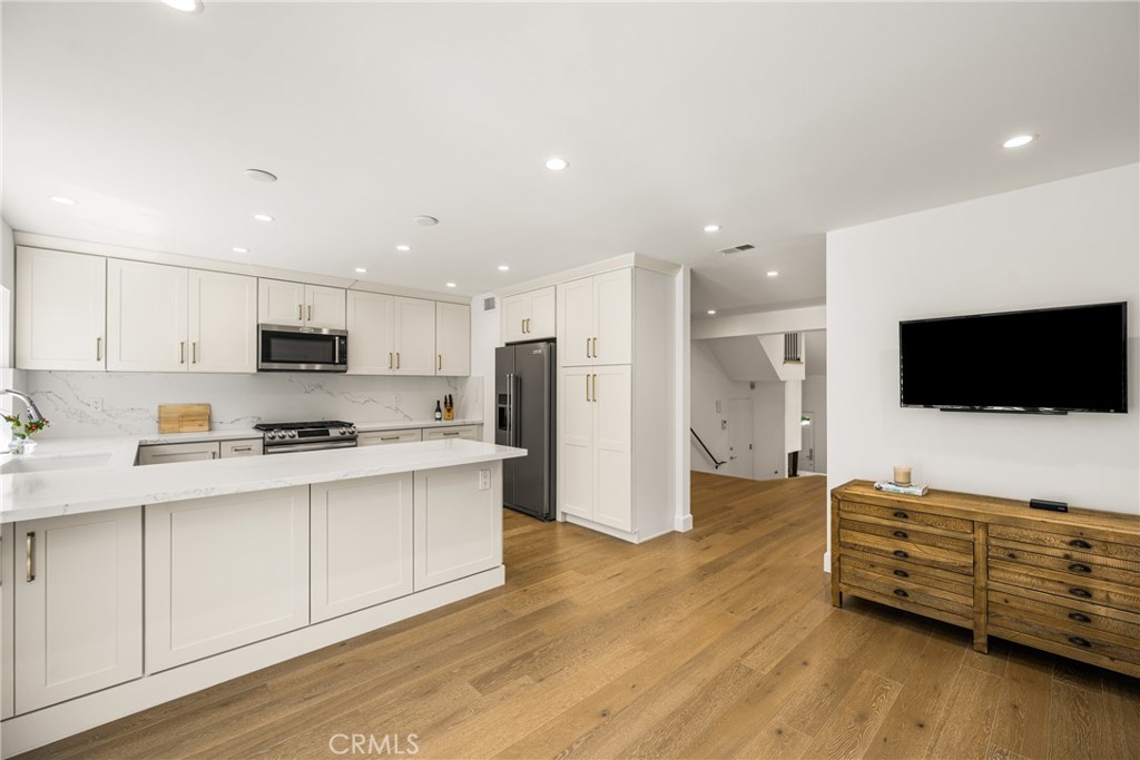 8 Moon Shadow, Unit 8 Irvine, CA 92603 - Photo 20 of 42 a kitchen with stainless steel appliances a refrigerator and a stove top oven